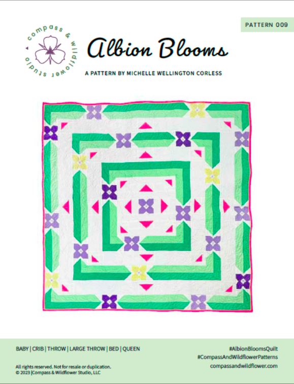 Albion Blooms quilt pattern cover. A geometric quilt with small flower motifs surrounded by repeating medallion strips and triangles. Made in purple, pink, yellow, and green fabrics on a white background. Pattern title and company logo.