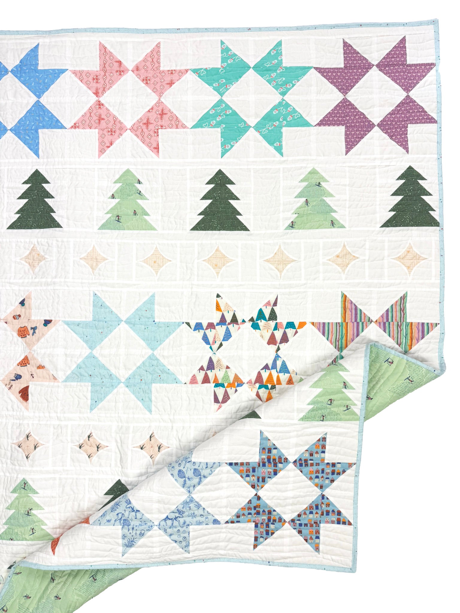 A quilt featuring a festive holiday pattern with rows of starbursts in blue, pink, teal, and purple, green Christmas trees, and diamond motifs on a white background.